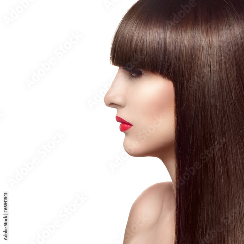 Portrait of beautiful fashion woman with long healthy red hair a