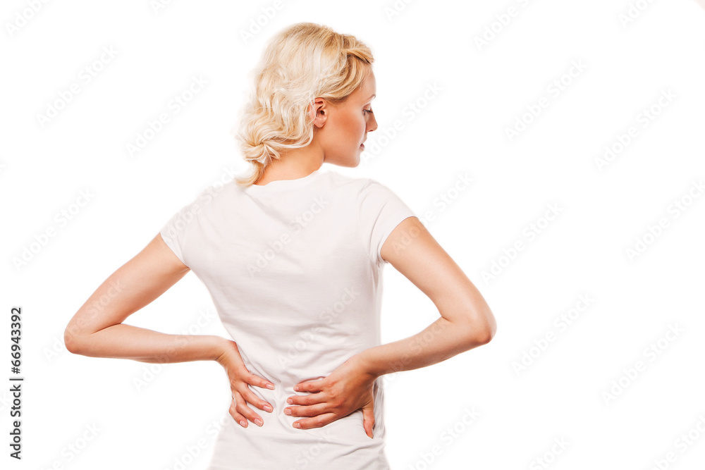 Woman with backache. Female holding her painful back Woman with backache. Female holding her painful back
