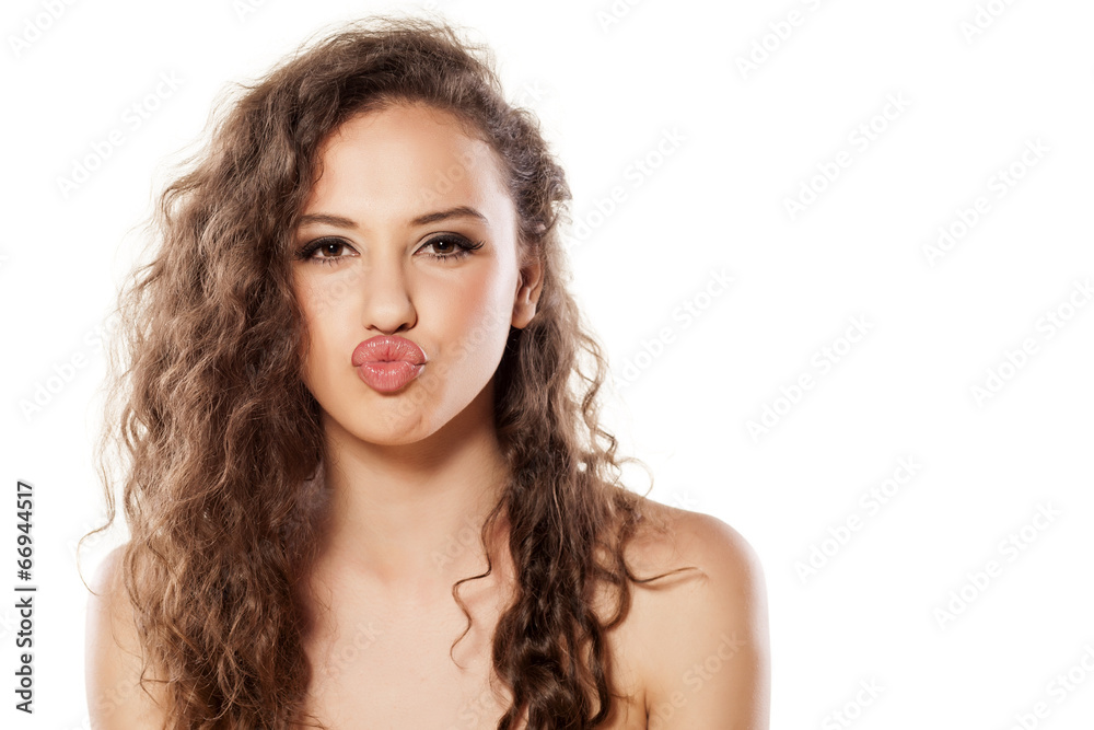 beautiful young girl with a kissing gesture beautiful young girl with a kissing gesture