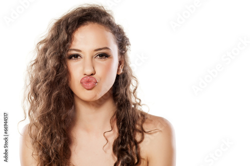 beautiful young girl with a kissing gesture