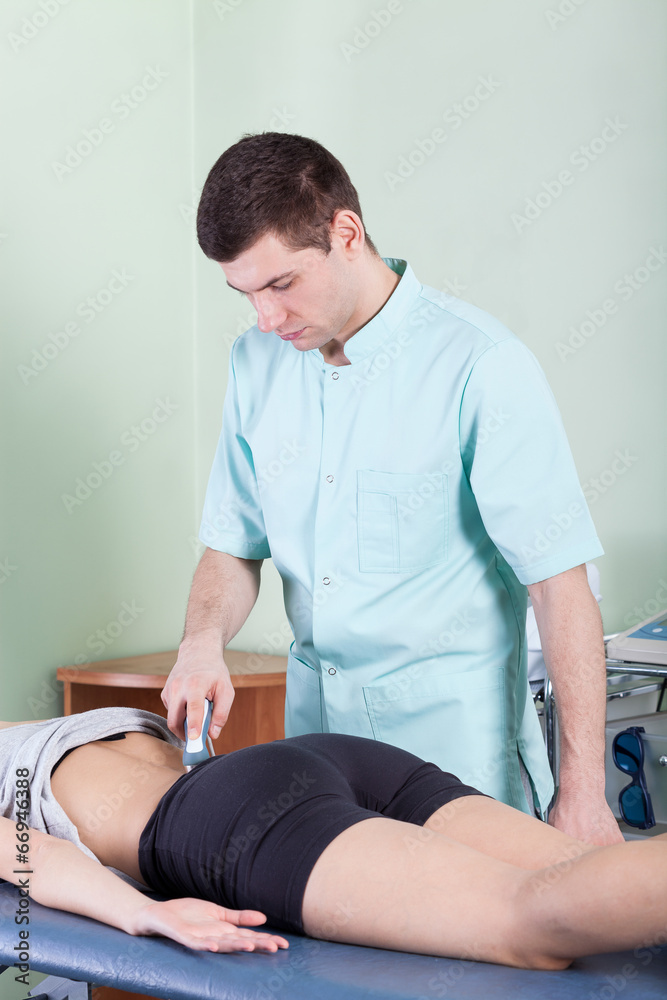 Treatment of back pain by laser therapy