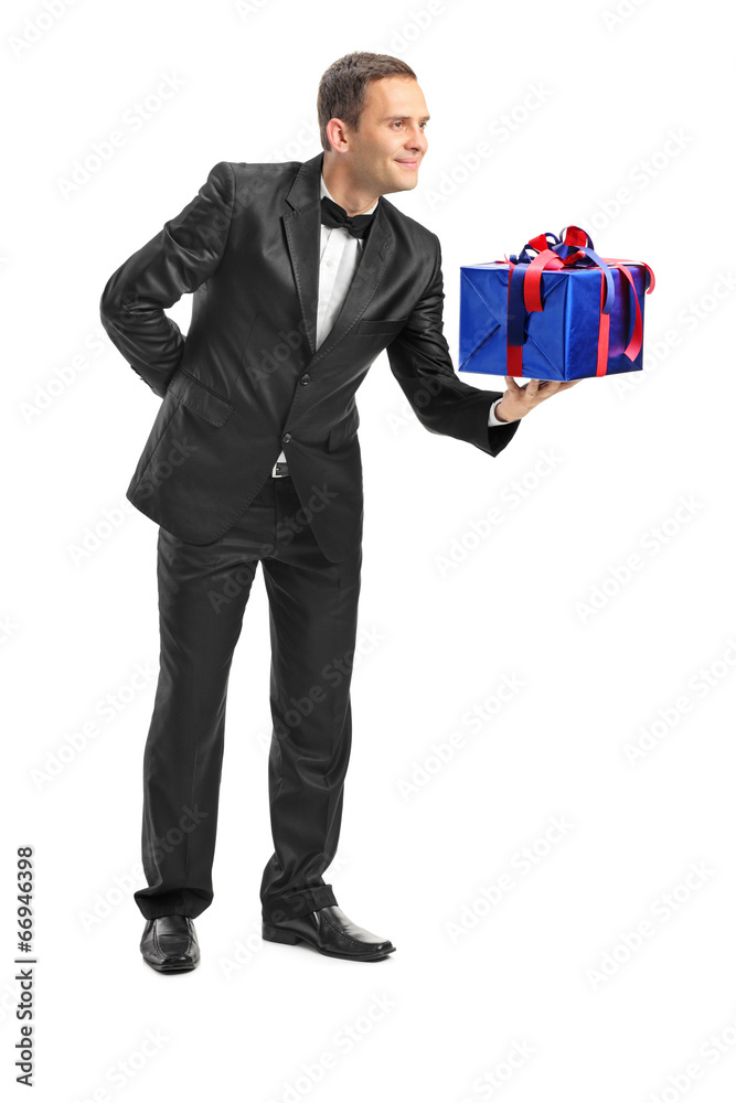 Classy guy giving a present to someone Classy guy giving a present to someone