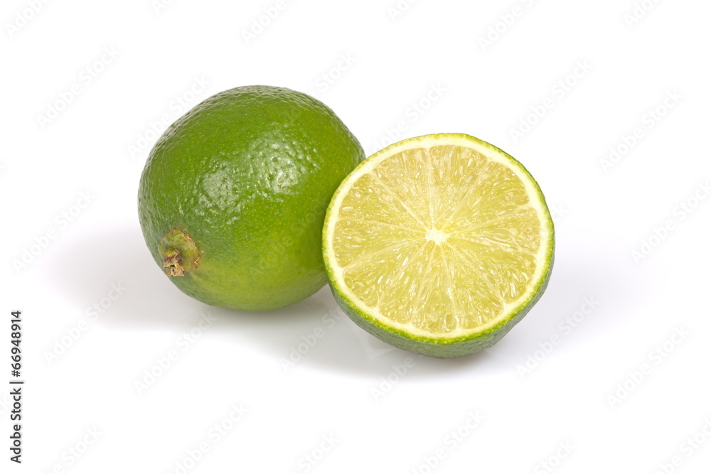 Whole citrus lime and half on the white background. Whole citrus lime and half on the white background.