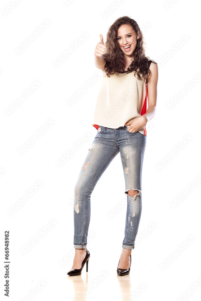 happy smiling young girl showing thumbs up happy smiling young girl showing thumbs up