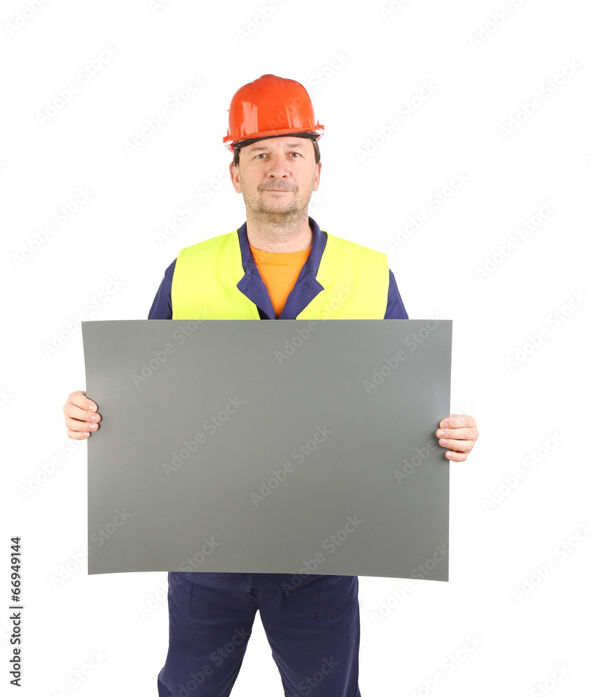 Worker holding gray paper sheet. Worker holding gray paper sheet.