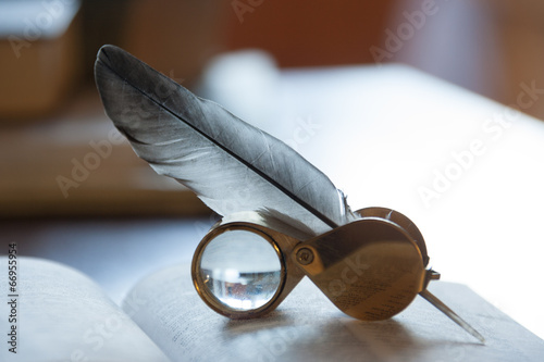 open book and quill pen
