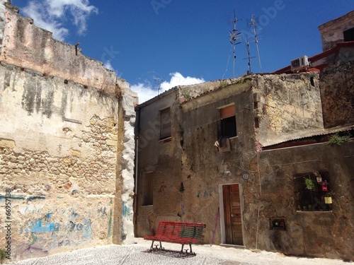 lonely red bench at sassari