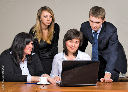 Businessgroup with laptop