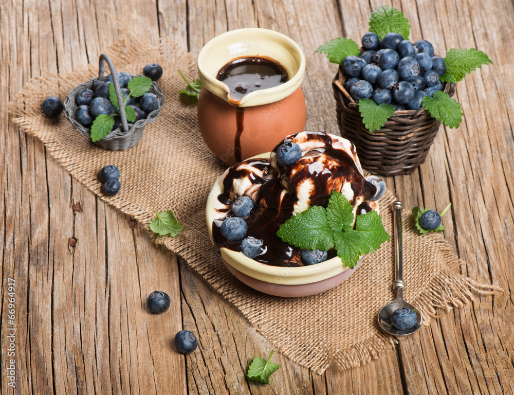 ice-cream, fresh blueberries and mint leaves on ceramic bowl, o ice-cream, fresh blueberries and mint leaves on ceramic bowl, o