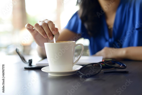 Young female stir cup