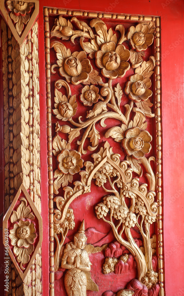 Old wooden door carved Thailand gold.