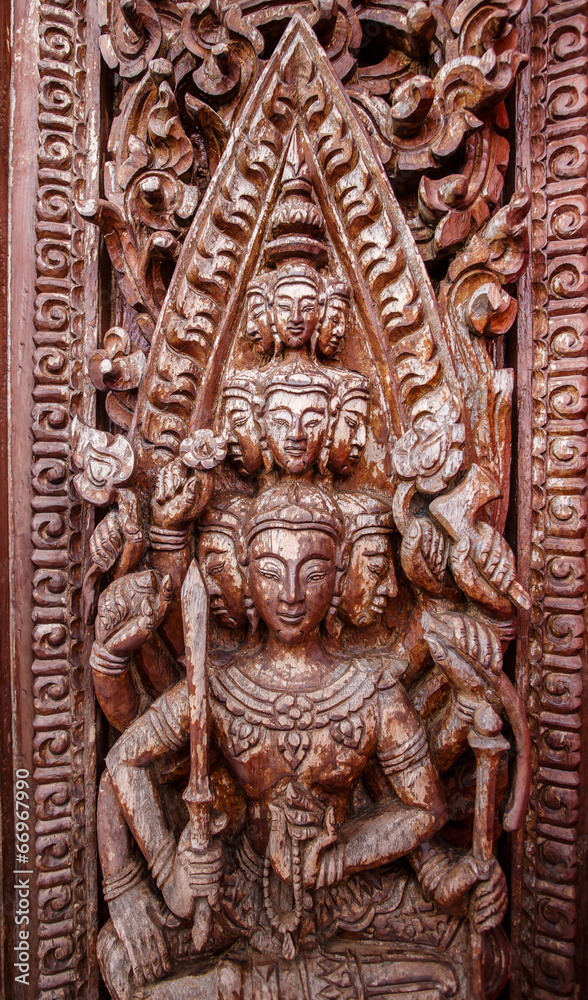 Old wooden door were carved Thai pattern
