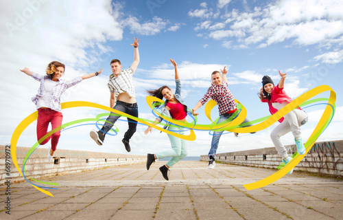 Fototapeta Naklejka Na Ścianę i Meble -  group of teenagers jumping