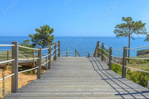 Wooden bridge going to the sea.