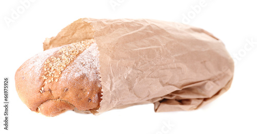 Loaf in paper bag isolated on white