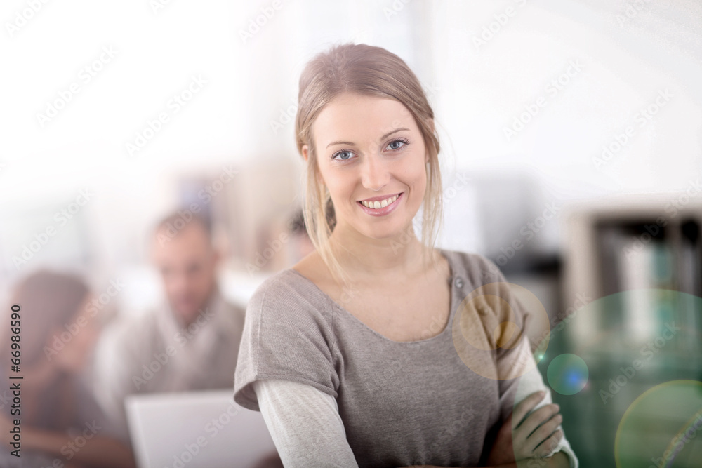 Portrait of pretty young woman in office Portrait of pretty young woman in office