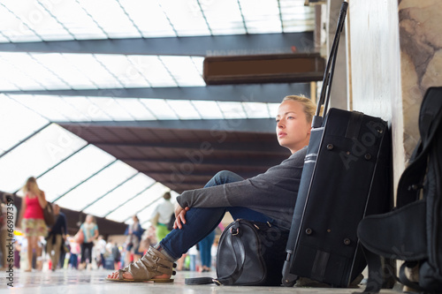 Female traveler waiting for departure. photo