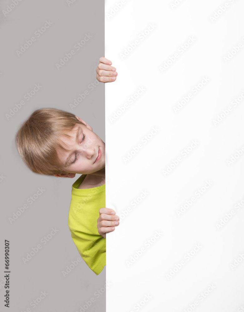 Boy looking around the corner Boy looking around the corner