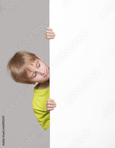 Boy looking around the corner