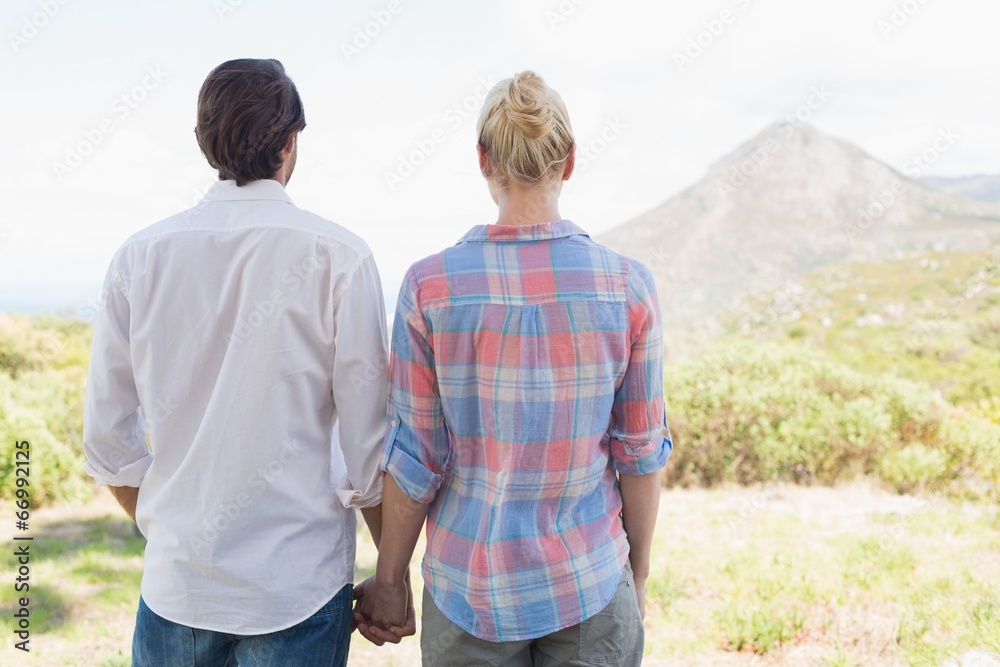Naklejka premium Cute couple standing holding hands