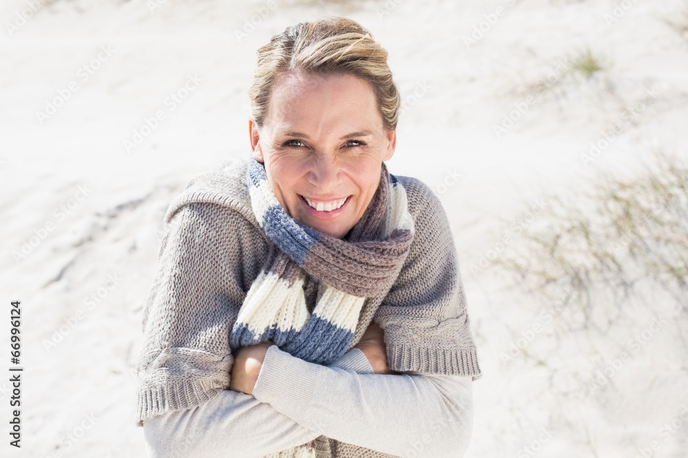 Attractive shivering blonde standing on the beach Attractive shivering blonde standing on the beach