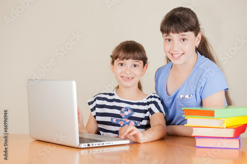 Two Cute Little School Girls With Laptop