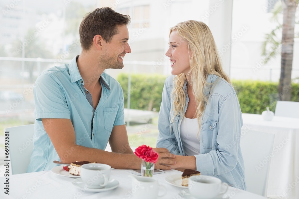 Hip young couple having desert and coffee together Hip young couple having desert and coffee together