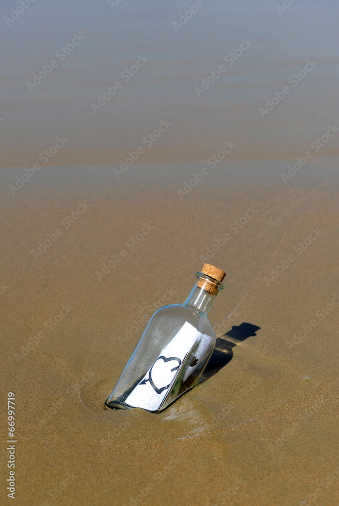 Bottle with message of love on the beach Bottle with message of love on the beach
