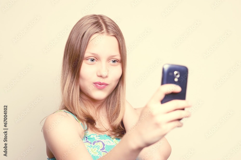 Happy teen girl make pictures of herself Happy teen girl make pictures of herself