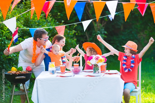 Big dutch family having grill party in garden
