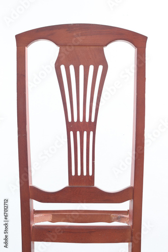 frame wooden chair against a white wall and floor