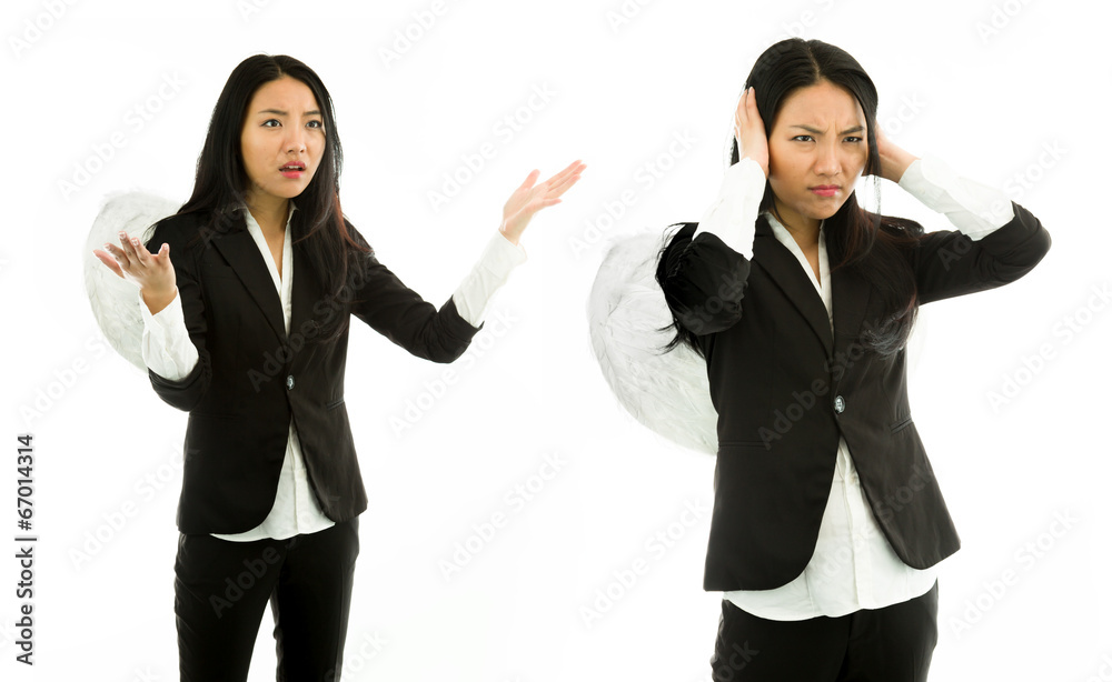 Asian young woman dressed as angel scolding to another isolated Asian young woman dressed as angel scolding to another isolated