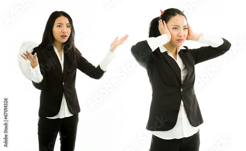 Angel side of a young Asian businesswoman scolding devil side