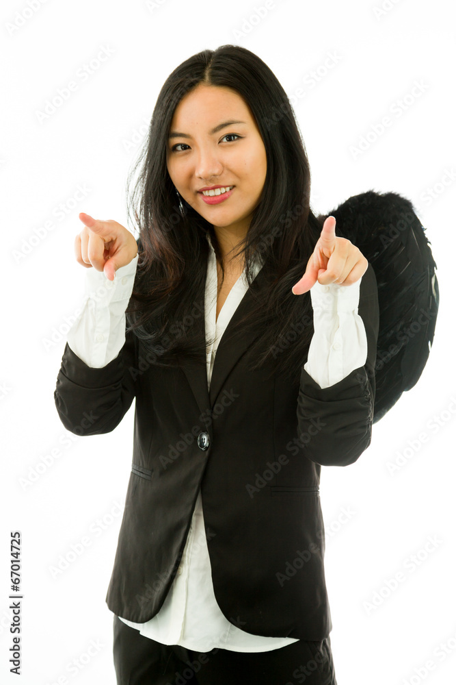 Asian young businesswoman dressed up as black angel pointing at Asian young businesswoman dressed up as black angel pointing at