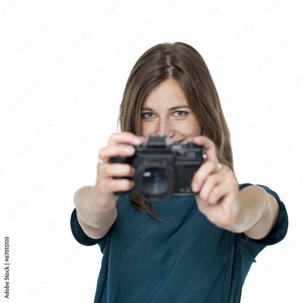 Happy young woman using a camera to take photo Happy young woman using a camera to take photo
