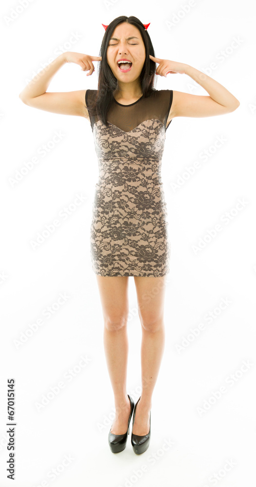 Asian young woman dressed up as a devil and shouting in