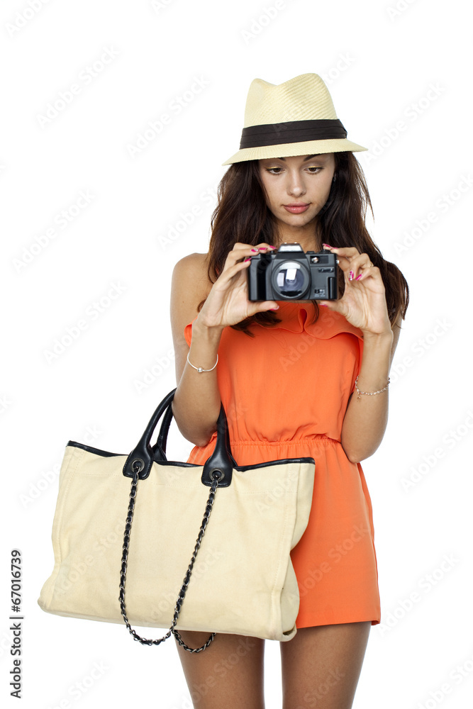 Happy young woman using a camera to take photo Happy young woman using a camera to take photo