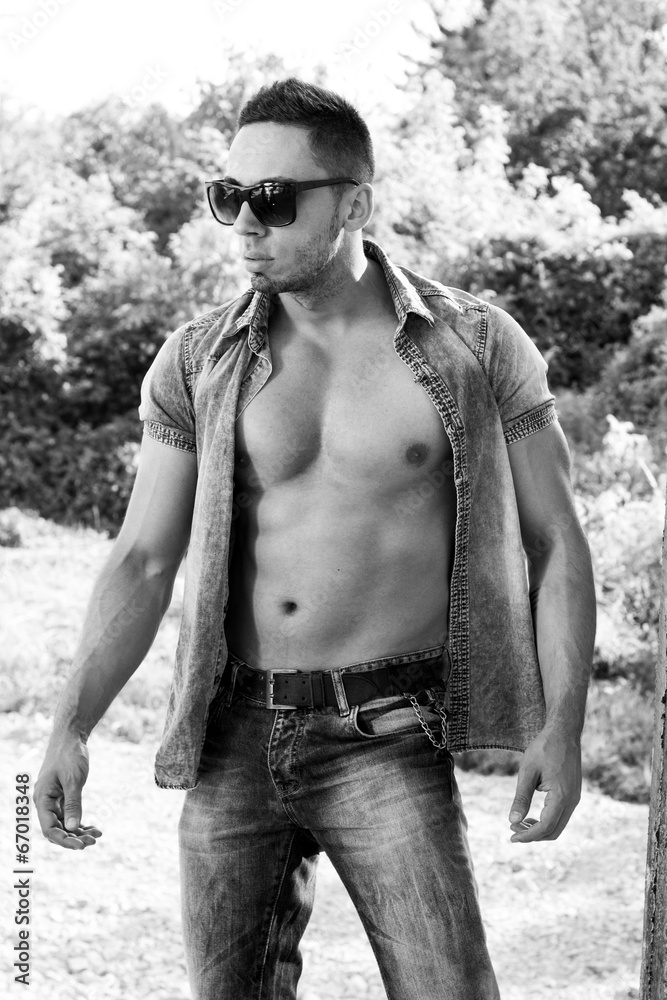 Black and White portrait of a very muscular male model in shirt Stock ...