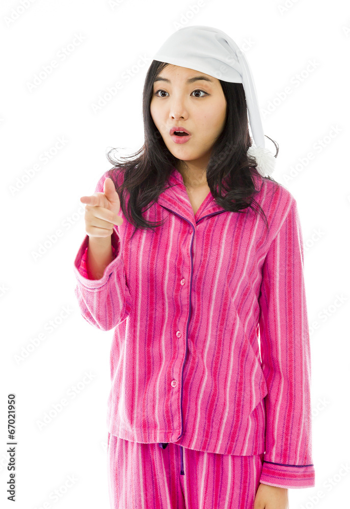 Young Asian woman pointing and looking shocked Young Asian woman pointing and looking shocked