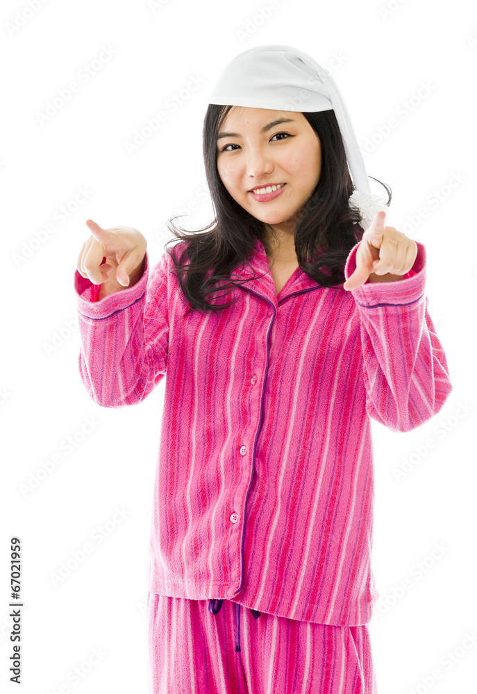 Smiling young Asian woman pointing towards camera from both Smiling young Asian woman pointing towards camera from both