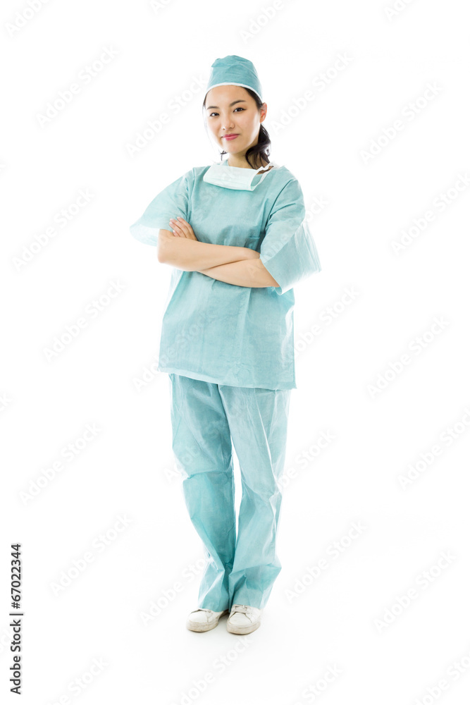 Confident Asian female surgeon standing with arms crossed Confident Asian female surgeon standing with arms crossed