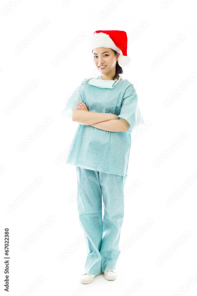 Asian female surgeon wearing Santa hat Asian female surgeon wearing Santa hat