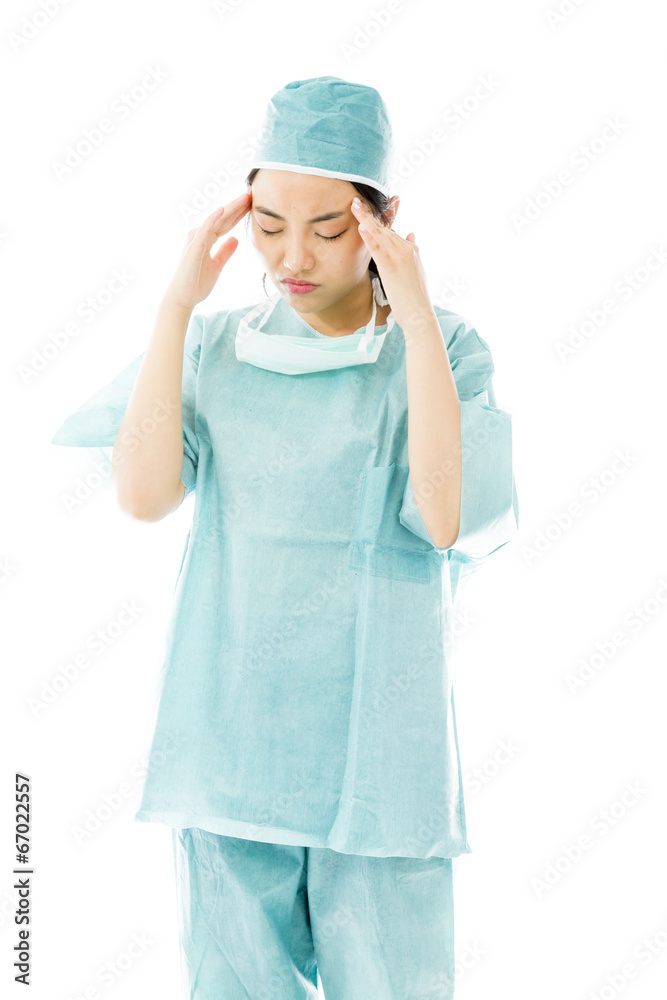 Asian female surgeon suffering from headache Asian female surgeon suffering from headache