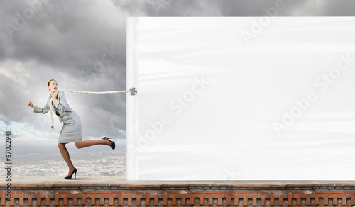 Bild auf Leinwand Woman with banner