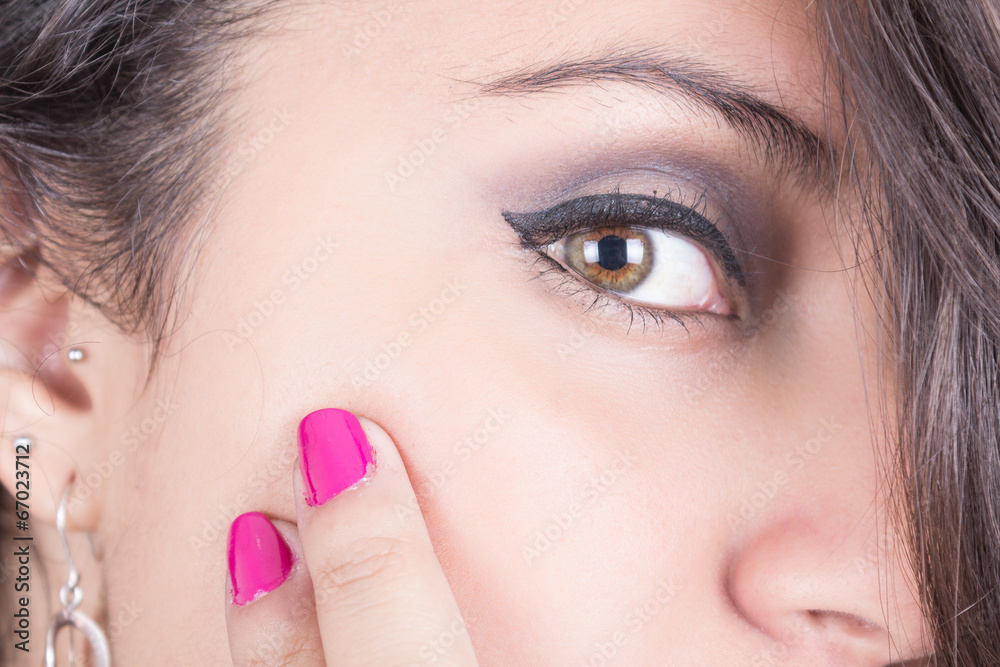 girl's face with pink nails closeup