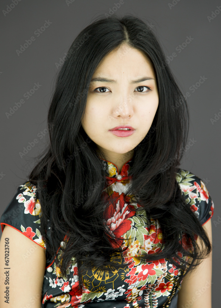 Asian young woman looking angry