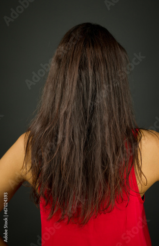 Rear view of a young woman showing her long hair