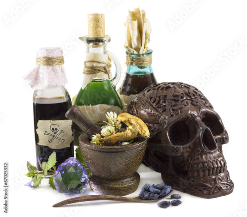 Magic still life with skull and bottles