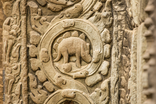 Obraz na płótnie Stegosaurus bas-relief on the wall of Ta Prohm temple at Angkor