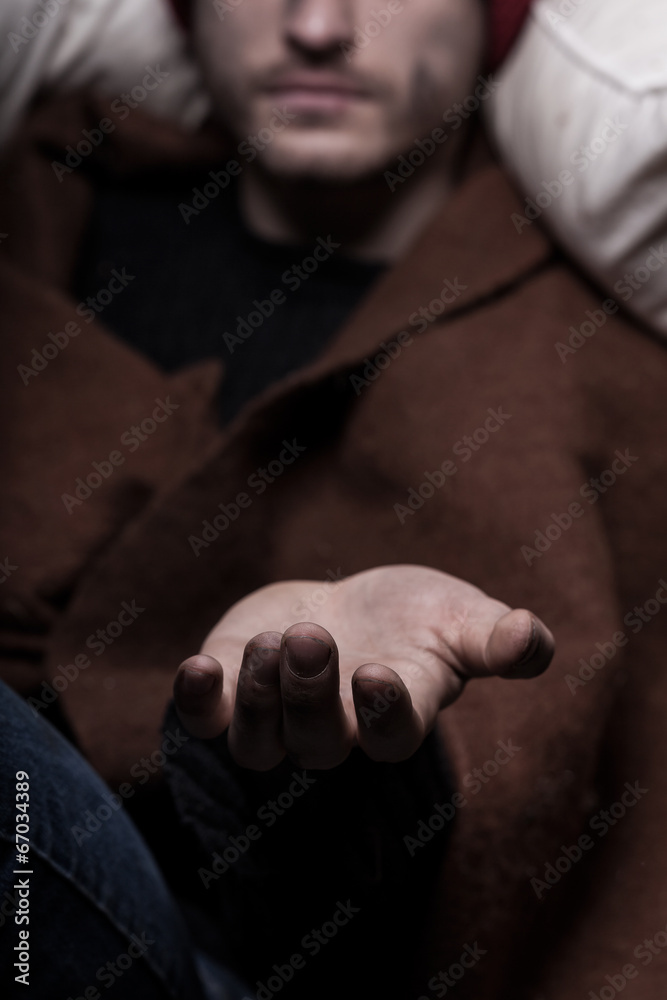 Male hand begging for money